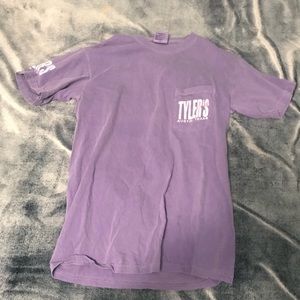 Purple T-shirt.
